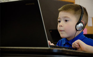 Catholic School Child on Laptop