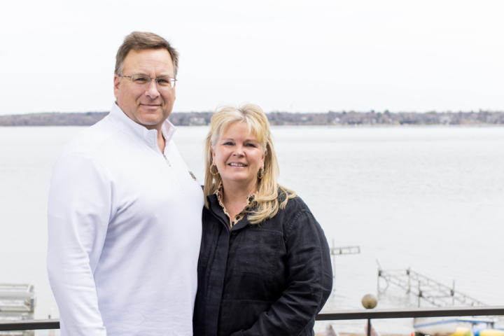Tim and Christine Steigauf stand in front of White Bear Lake.